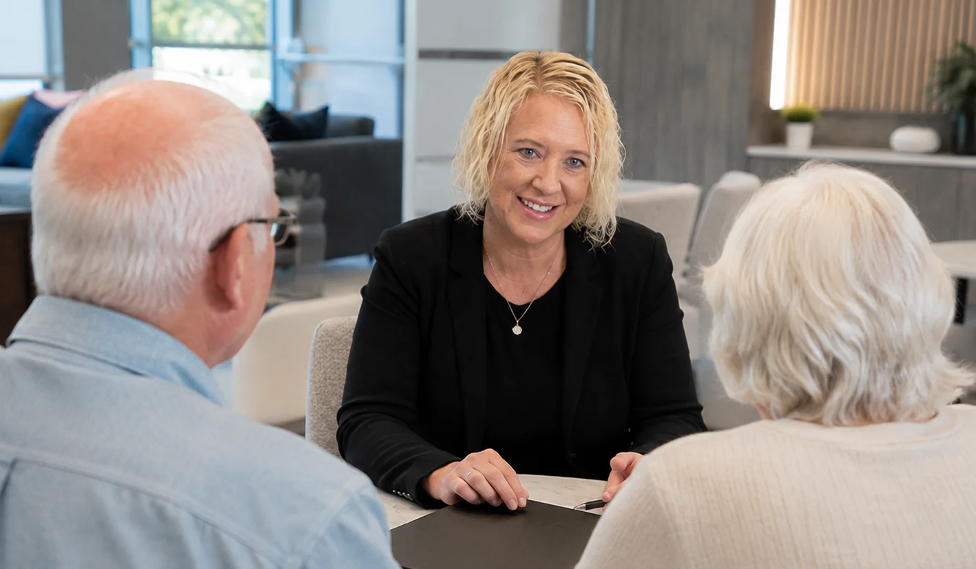 Liberty Savings Bank senior financing specialist meeting with a couple about their transition to senior living